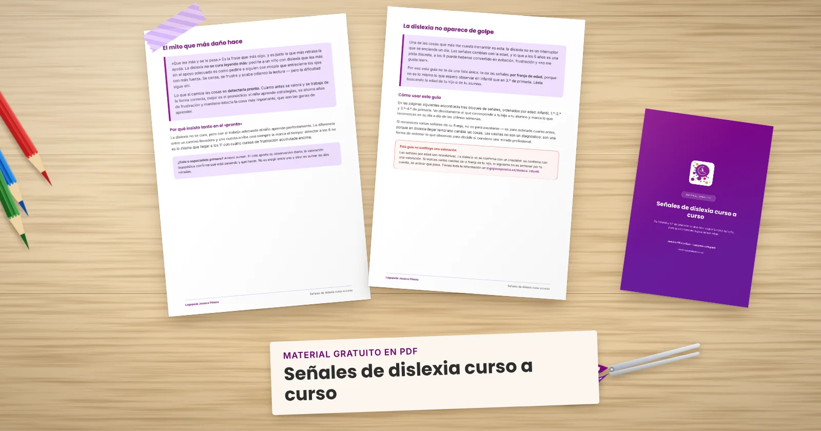 Dos páginas impresas de «Señales de dislexia curso a curso» sujetas con cinta washi sobre una mesa de madera, con la portada asomando. Alrededor, una etiqueta de papel con el título, lápices de colores y unas tijeras.